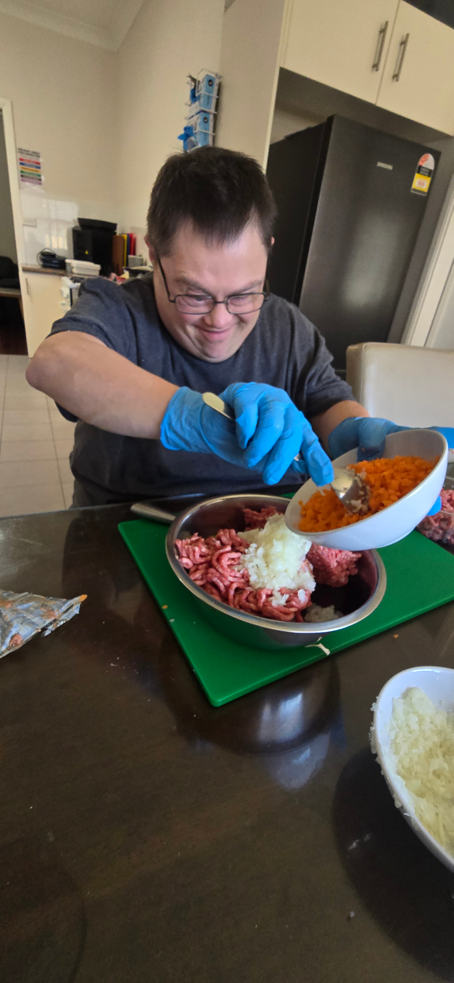 A participant preparing a meal in the kitchen