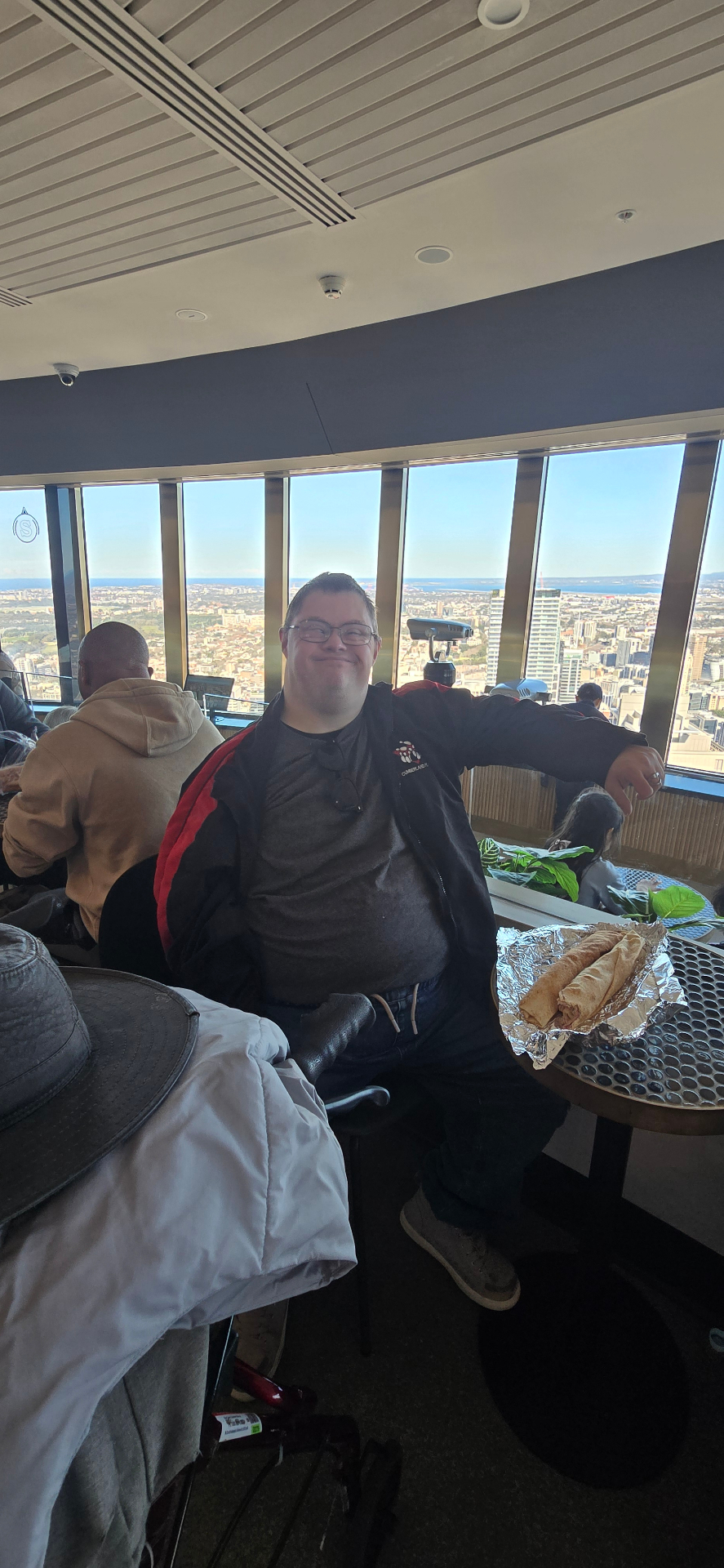 A participant enjoying lunch high above the city at Sydney Tower