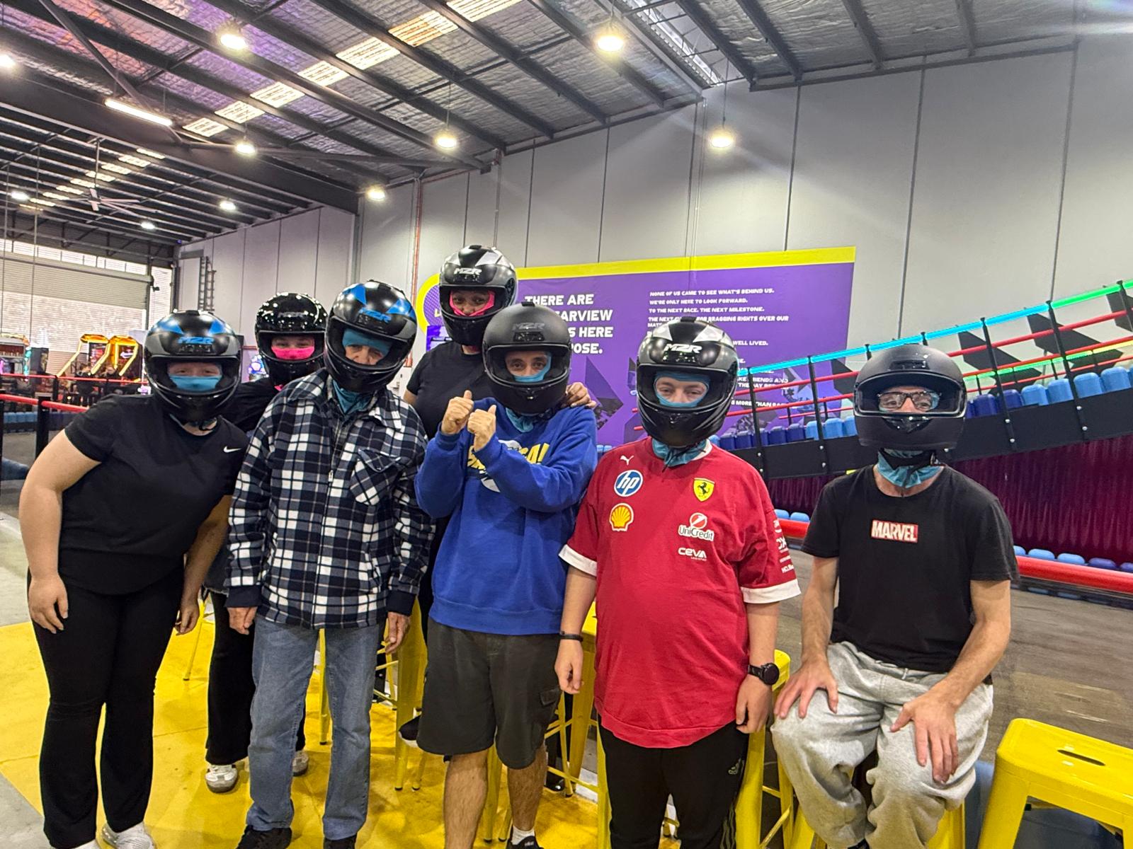 The group suited up in helmets before go-karting