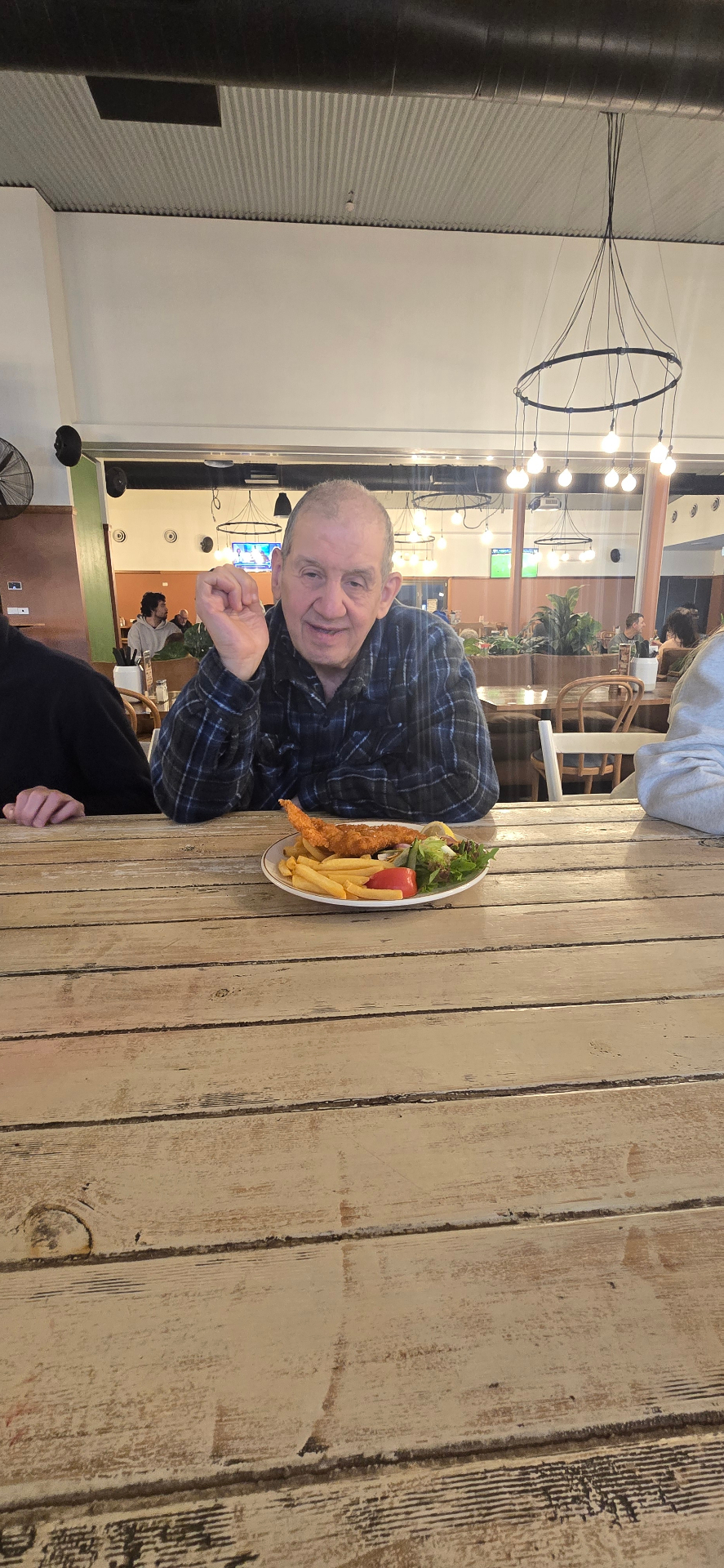 A participant enjoying a fish and chips lunch out
